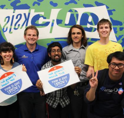 Students holding voting signs